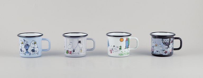 Muurla, Finland. Four enamel mugs with different motifs from the Moomin troll universe.