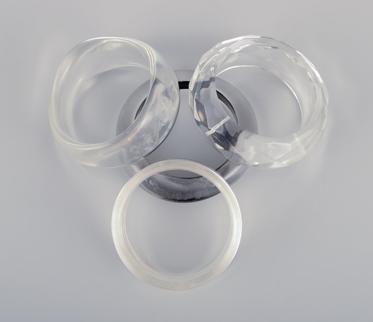 French jewelry designer.Four bracelets in clear plastic.