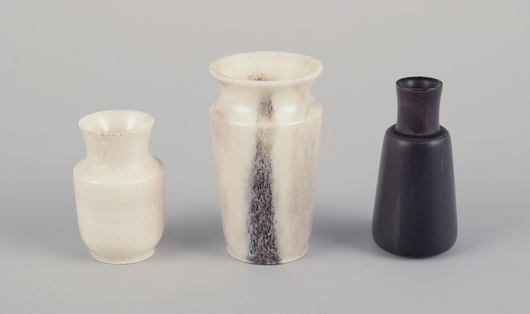 Swedish artist.Three miniature vases carved from moose bone.