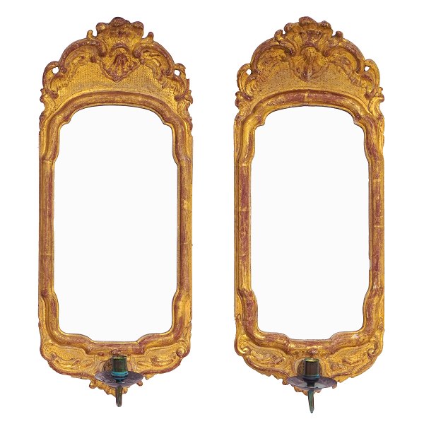 Pair of gilt Rococo mirros made in Stockholm circa 1760. Size: 60x24,5cm
