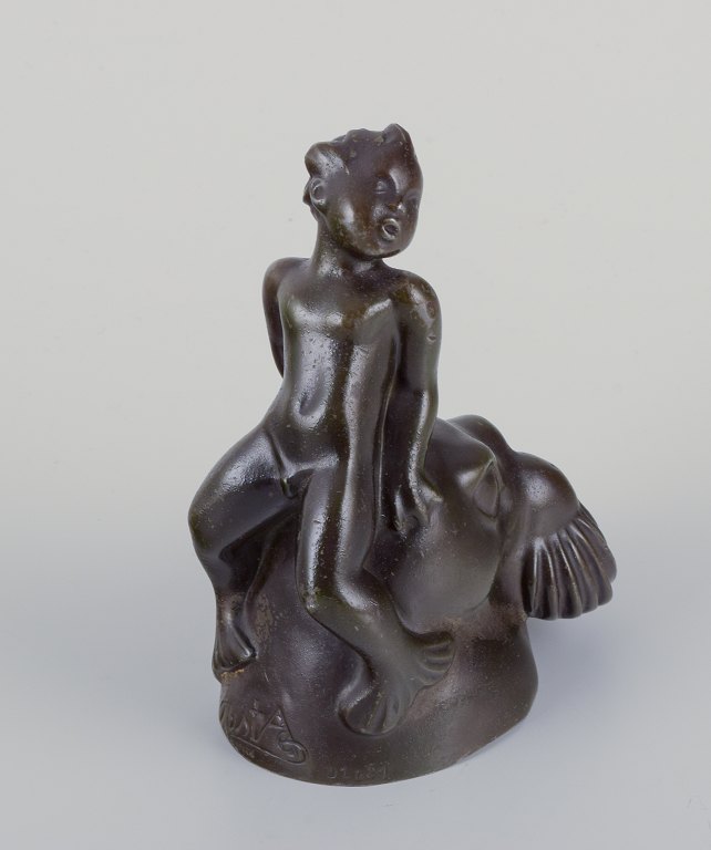 Just Andersen, Denmark.Figurine of a boy sitting on the head of a walrus.