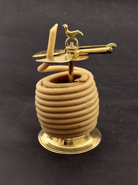 Brass stack candlestick with bird on top